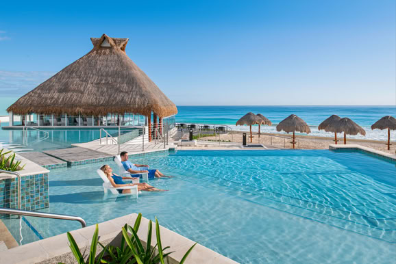 Oceanfront infinity pool capturing resort luxury, relaxation, and destination experience.