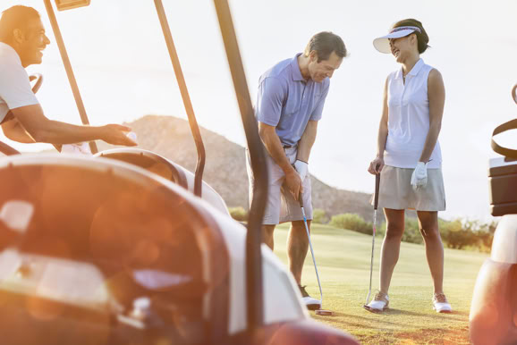 Lifestyle imagery capturing guests enjoying leisure activities within a resort golf setting.