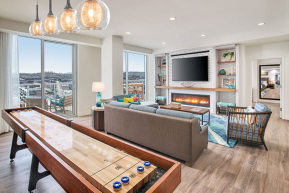 Living space featuring recreational amenities and seating designed for guest engagement and comfort.